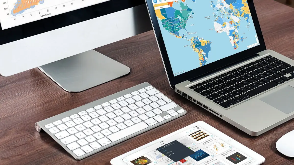 monitor-laptop-and-ipad-on-a-wooden-desk.jpg