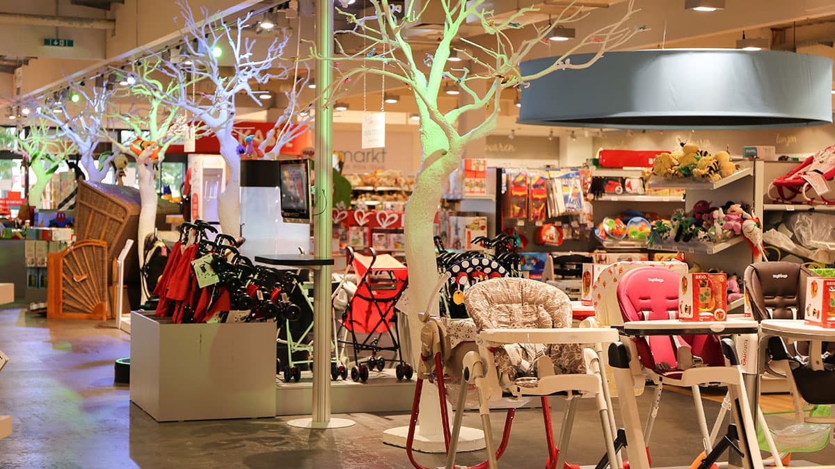 Photo showing a babymarkt store interior with various childcare-related items on display